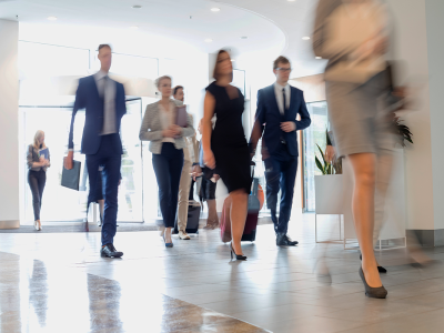 People walking in an office foyer