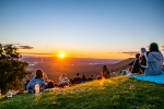 People gathered at sunset on Tambourine Mountain